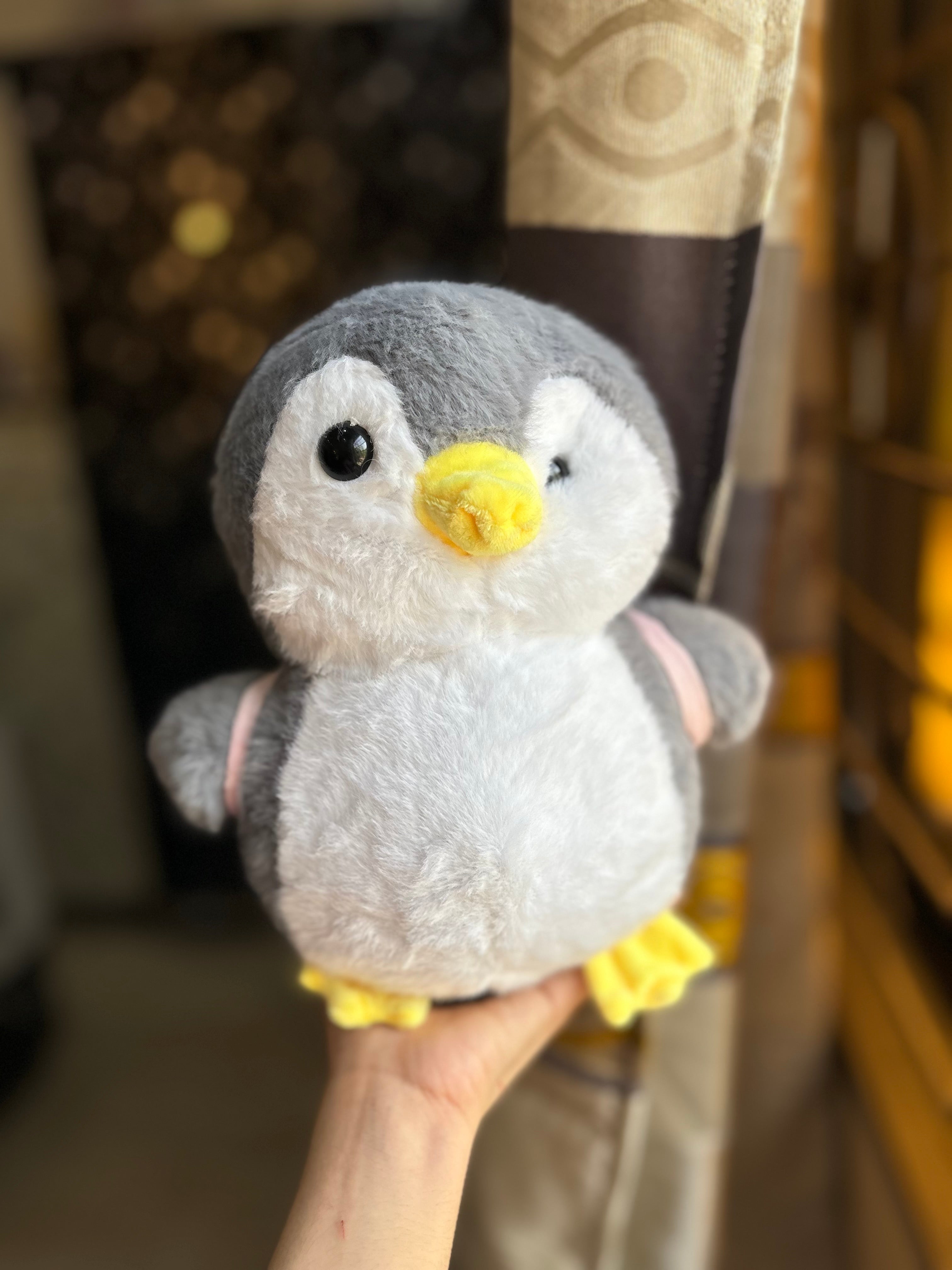 Plushie penguin with removable bagpack