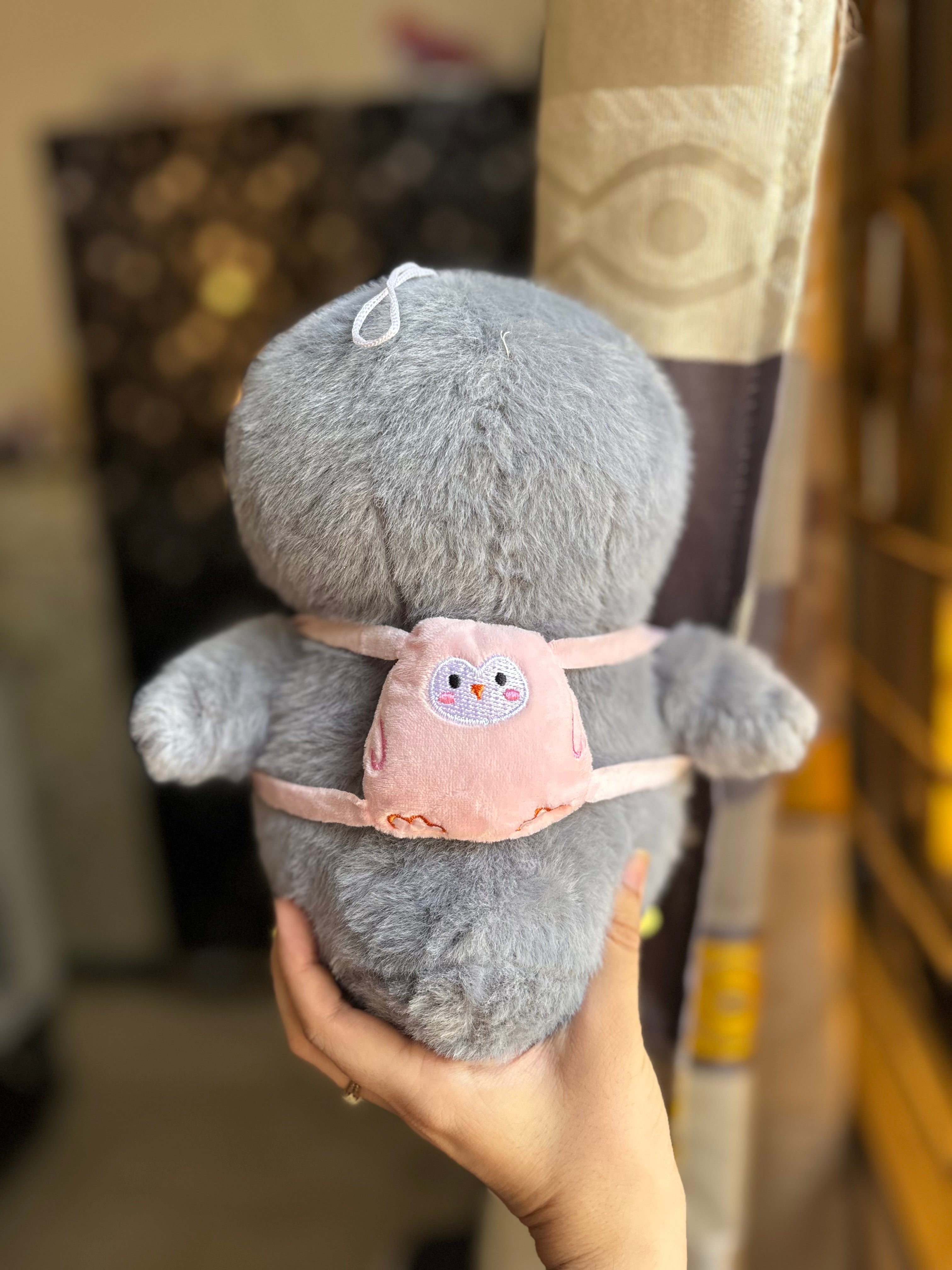 Plushie penguin with removable bagpack